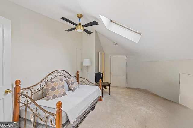 1036 Oxford Rd NE, Atlanta, GA 30306 - bedroom with a skylight, vaulted ceiling, light colored carpet, and ceiling fan