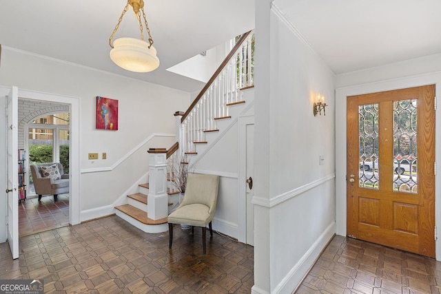 1036 Oxford Rd NE, Atlanta, GA 30306 - entrance foyer featuring plenty of natural light, stairs, and ornamental molding