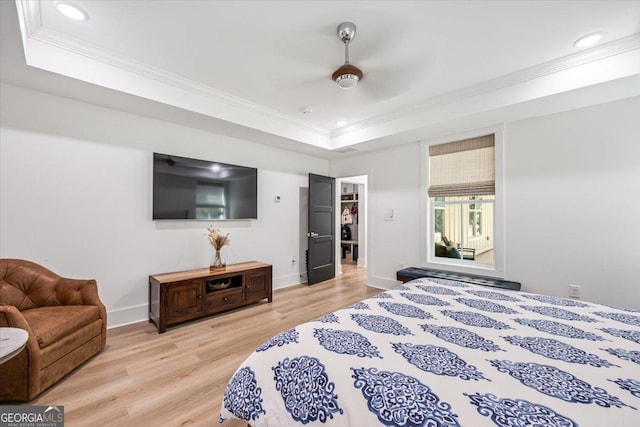 1585 Parks Rd, Forsyth, GA 31029 - bedroom featuring ornamental molding, a tray ceiling, light wood-style flooring, recessed lighting, and a ceiling fan