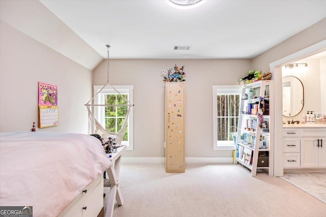 1585 Parks Rd, Forsyth, GA 31029 - bedroom featuring ensuite bathroom, light carpet, and vaulted ceiling