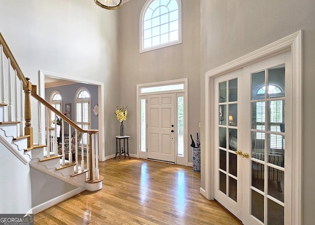 1620 Silverleaf Way, Alpharetta, GA 30005 - foyer with plenty of natural light, wood finished floors, stairway, and a towering ceiling