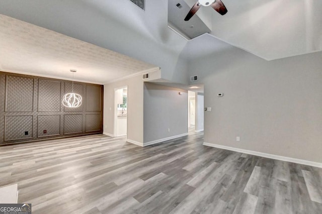 6221 Willow Run Rd, Peachtree Corners, GA 30092 - unfurnished living room featuring wood finished floors and a ceiling fan