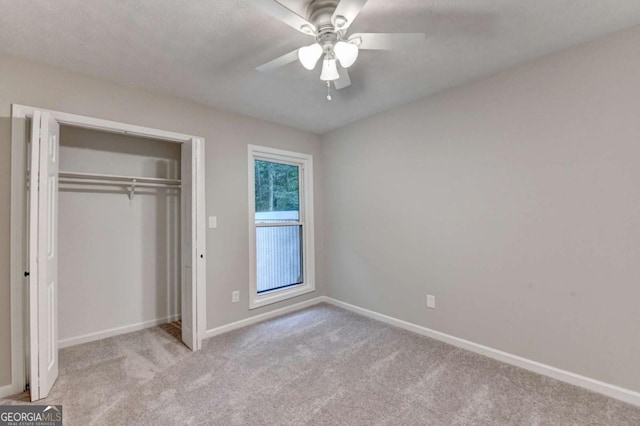 6221 Willow Run Rd, Peachtree Corners, GA 30092 - unfurnished bedroom with carpet, a closet, and a ceiling fan