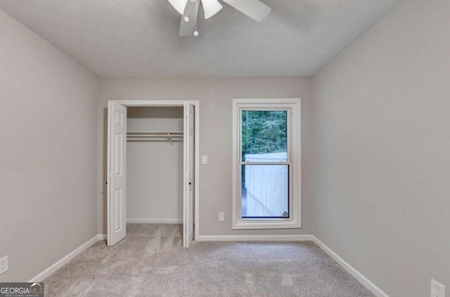 6221 Willow Run Rd, Peachtree Corners, GA 30092 - unfurnished bedroom with light carpet, a closet, and a ceiling fan