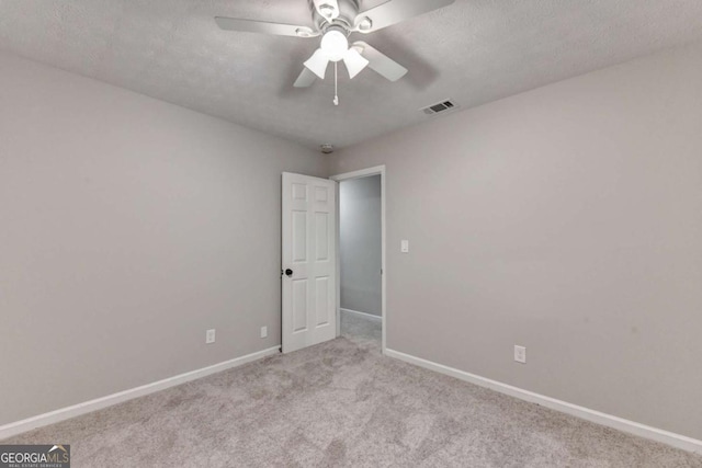 6221 Willow Run Rd, Peachtree Corners, GA 30092 - unfurnished room featuring carpet, a ceiling fan, and a textured ceiling