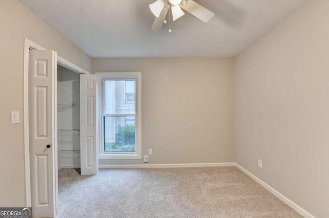 6221 Willow Run Rd, Peachtree Corners, GA 30092 - unfurnished bedroom with carpet floors, a closet, and a ceiling fan