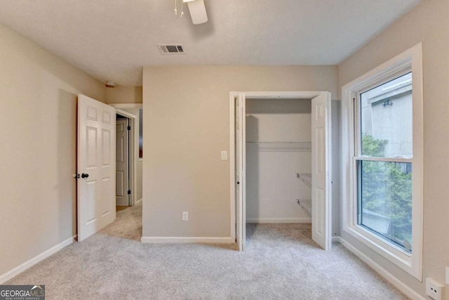 6221 Willow Run Rd, Peachtree Corners, GA 30092 - unfurnished bedroom with carpet flooring, a closet, and a ceiling fan