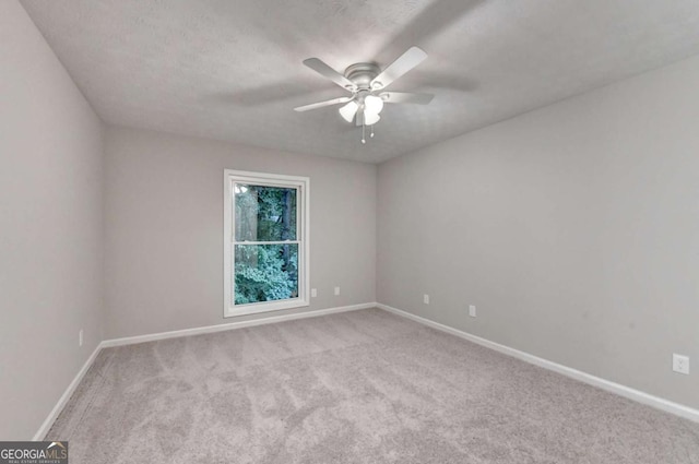 6221 Willow Run Rd, Peachtree Corners, GA 30092 - carpeted empty room with a ceiling fan and baseboards