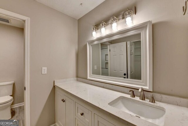 6221 Willow Run Rd, Peachtree Corners, GA 30092 - bathroom with toilet and vanity