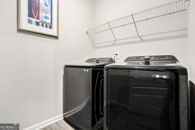 176 Malbone St SW, Cartersville, GA 30120 - washroom featuring washing machine and dryer and wood finished floors