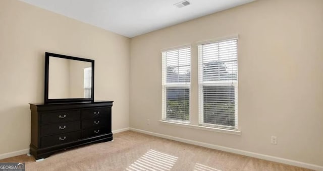 176 Calm Oaks Cir, Savannah, GA 31419 - unfurnished bedroom featuring baseboards and light colored carpet
