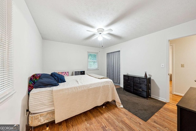 155 Windy Hill Ct, Alpharetta, GA 30004 - bedroom featuring wood finished floors, a textured ceiling, and ceiling fan