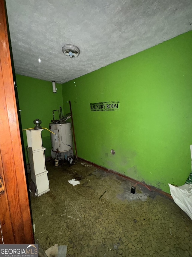 8373 Chicago Ave, Douglasville, GA 30134 - laundry room with water heater and a textured ceiling