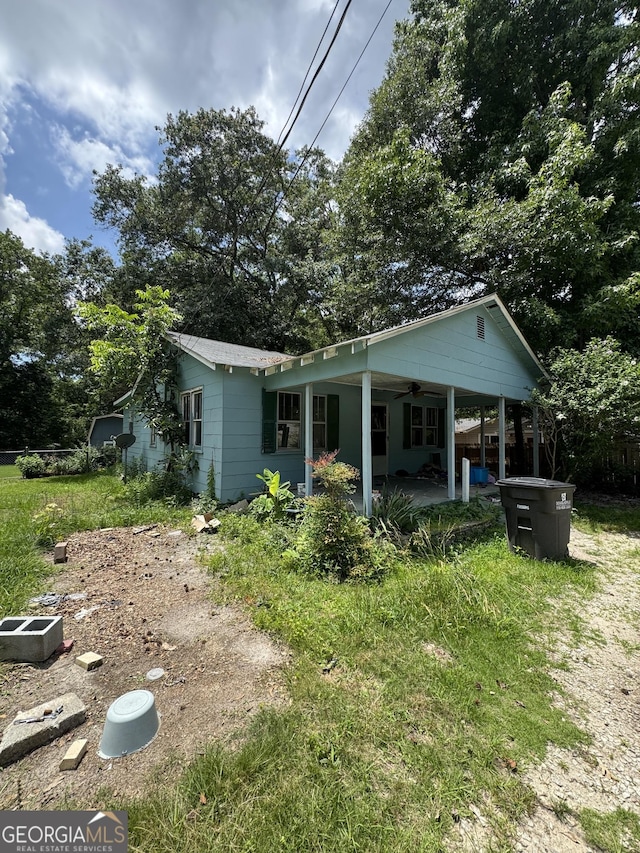 8373 Chicago Ave, Douglasville, GA 30134 - rear view of house featuring a ceiling fan and a patio