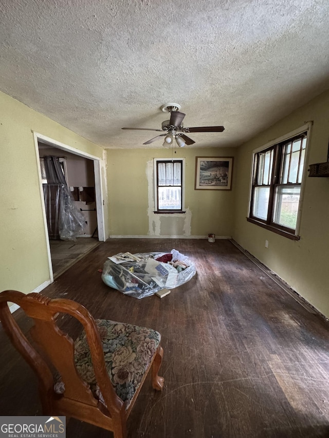 8373 Chicago Ave, Douglasville, GA 30134 - living area featuring wood finished floors, a textured ceiling, and ceiling fan