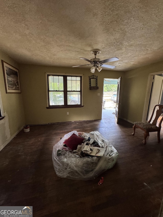 8373 Chicago Ave, Douglasville, GA 30134 - spare room featuring a textured ceiling, plenty of natural light, wood finished floors, and a ceiling fan