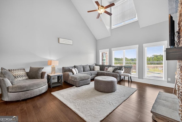 2112 Meadowood Cv, Monroe, GA 30655 - living room with high vaulted ceiling, a ceiling fan, dark wood finished floors, and a stone fireplace