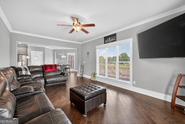 2112 Meadowood Cv, Monroe, GA 30655 - living area featuring ceiling fan, crown molding, and dark wood-type flooring