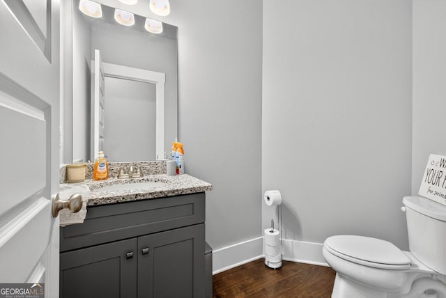 2112 Meadowood Cv, Monroe, GA 30655 - half bath with vanity and wood finished floors