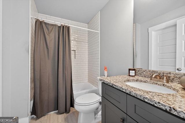 2112 Meadowood Cv, Monroe, GA 30655 - bathroom featuring vanity, shower / tub combo, and wood finished floors