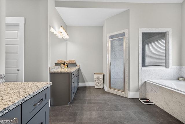2112 Meadowood Cv, Monroe, GA 30655 - full bathroom featuring vanity, a stall shower, a bath, and tile patterned flooring