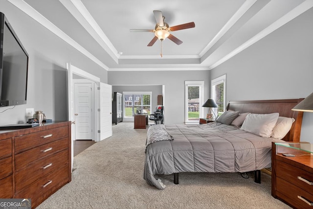 2112 Meadowood Cv, Monroe, GA 30655 - carpeted bedroom featuring a tray ceiling, crown molding, and ceiling fan