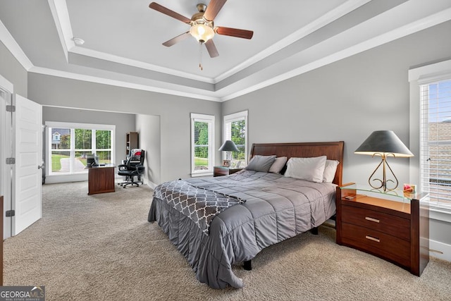 2112 Meadowood Cv, Monroe, GA 30655 - bedroom featuring light colored carpet, a raised ceiling, crown molding, ceiling fan, and an office area