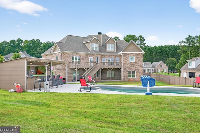 2112 Meadowood Cv, Monroe, GA 30655 - rear view of property with a patio area, a chimney, stairway, and brick siding