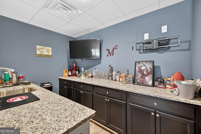 2112 Meadowood Cv, Monroe, GA 30655 - bar featuring a drop ceiling and light wood-style floors