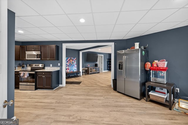 2112 Meadowood Cv, Monroe, GA 30655 - kitchen with appliances with stainless steel finishes, dark brown cabinets, light wood-type flooring, a drop ceiling, and recessed lighting