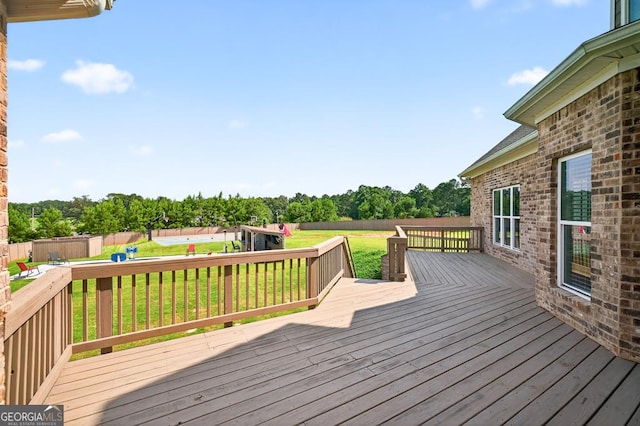 2112 Meadowood Cv, Monroe, GA 30655 - wooden deck featuring a yard and view of wooded area