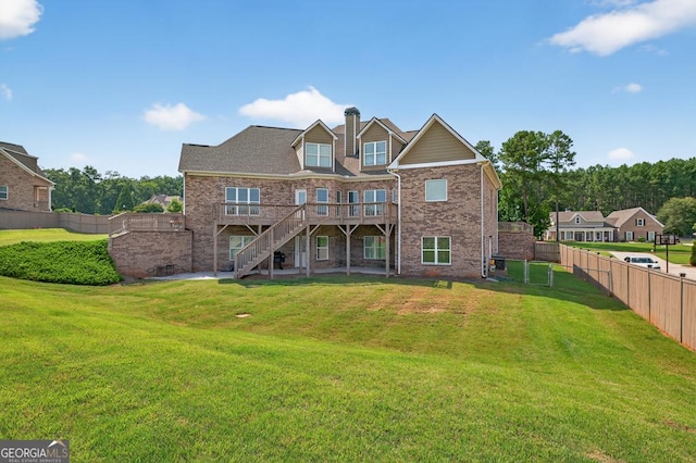 2112 Meadowood Cv, Monroe, GA 30655 - rear view of property featuring stairs, a deck, brick siding, and a chimney