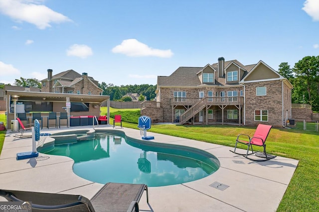 2112 Meadowood Cv, Monroe, GA 30655 - view of swimming pool featuring a pool with connected hot tub, a patio area, and a fenced backyard