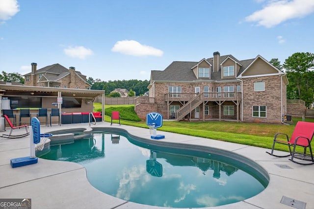 2112 Meadowood Cv, Monroe, GA 30655 - view of pool with a patio area, a pool with connected hot tub, stairs, and a wooden deck
