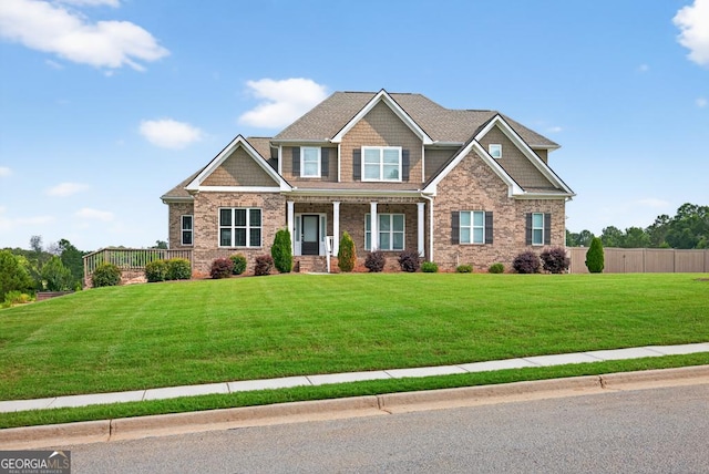 2112 Meadowood Cv, Monroe, GA 30655 - craftsman house with a porch and brick siding