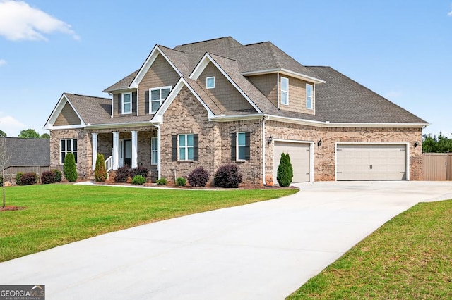 2112 Meadowood Cv, Monroe, GA 30655 - craftsman inspired home featuring driveway, brick siding, and covered porch