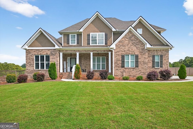2112 Meadowood Cv, Monroe, GA 30655 - craftsman house with brick siding and a porch