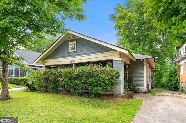 1639 Rogers Ave SW, Atlanta, GA 30310 - bungalow-style home with a front yard and brick siding