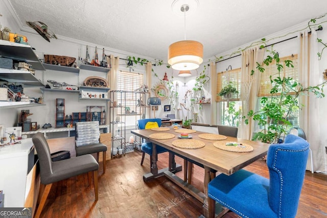 1639 Rogers Ave SW, Atlanta, GA 30310 - dining area with wood finished floors, a textured ceiling, and ornamental molding