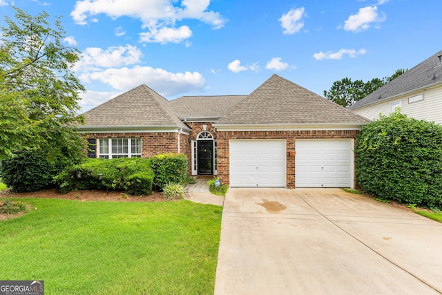 10 Links Ct, Newnan, GA 30265 - view of front of house with a shingled roof, an attached garage, brick siding, and a front lawn