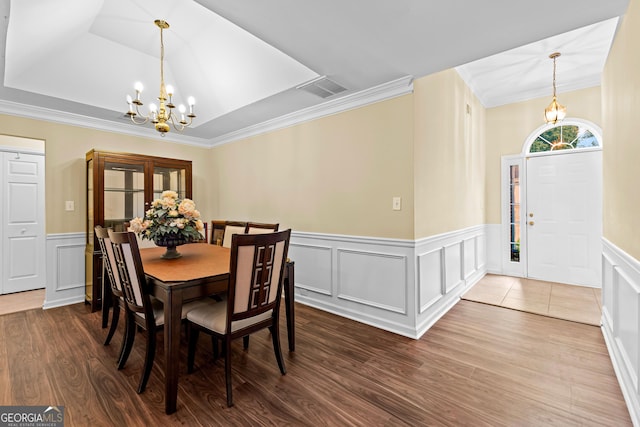 10 Links Ct, Newnan, GA 30265 - dining area with a chandelier, a wainscoted wall, wood finished floors, a raised ceiling, and ornamental molding