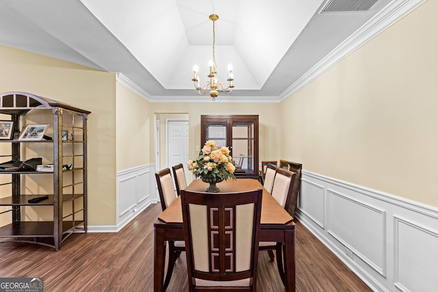 10 Links Ct, Newnan, GA 30265 - dining room featuring a chandelier, dark wood finished floors, wainscoting, a decorative wall, and a raised ceiling