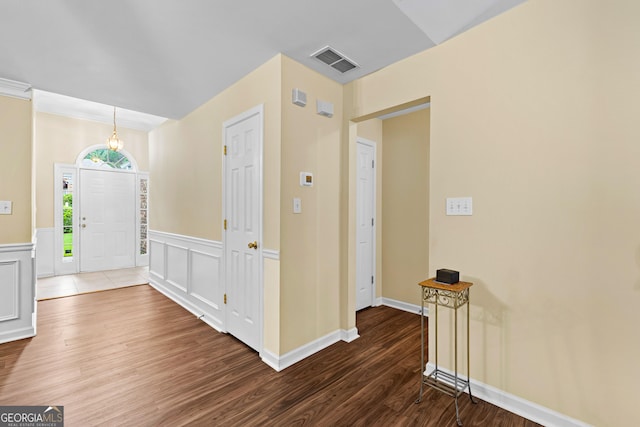 10 Links Ct, Newnan, GA 30265 - foyer entrance featuring wood finished floors, a wainscoted wall, and a decorative wall