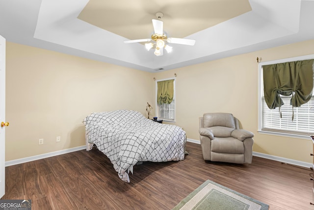10 Links Ct, Newnan, GA 30265 - bedroom with a raised ceiling, wood finished floors, and ceiling fan