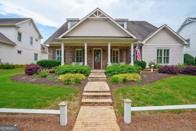 1911 Bent Pine Park, Statham, GA 30666 - craftsman-style home with a front lawn, covered porch, stone siding, and a shingled roof