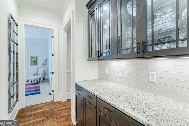 1911 Bent Pine Park, Statham, GA 30666 - bar area featuring crown molding, dark wood-style floors, and backsplash