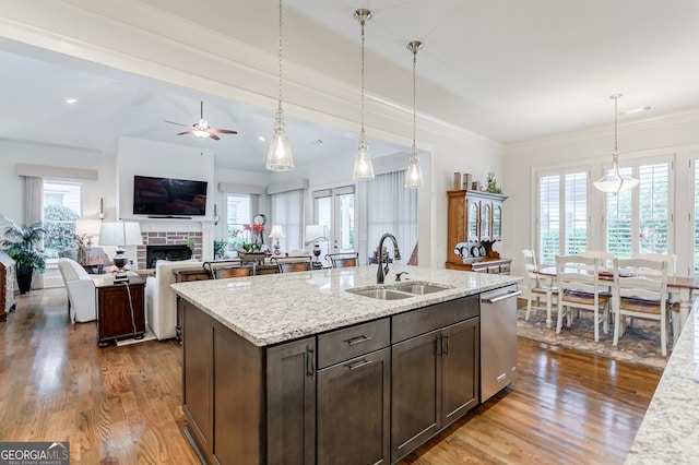 1911 Bent Pine Park, Statham, GA 30666 - kitchen featuring dishwasher, wood finished floors, dark brown cabinets, pendant lighting, and crown molding