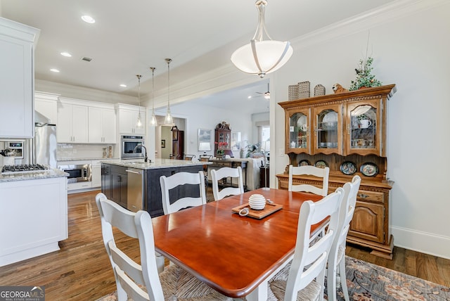 1911 Bent Pine Park, Statham, GA 30666 - dining space with dark wood finished floors, ornamental molding, recessed lighting, and a ceiling fan