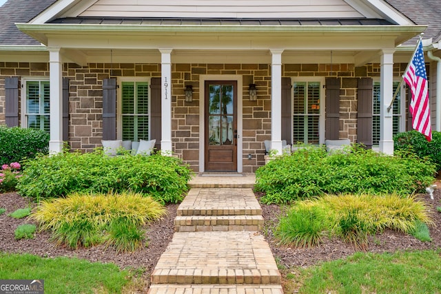 1911 Bent Pine Park, Statham, GA 30666 - view of exterior entry with covered porch, roof with shingles, and a standing seam roof