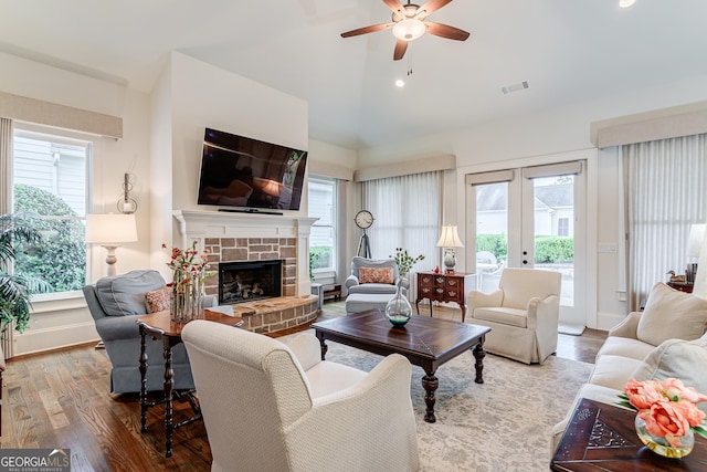 1911 Bent Pine Park, Statham, GA 30666 - living area with ceiling fan, healthy amount of natural light, lofted ceiling, wood finished floors, and a stone fireplace